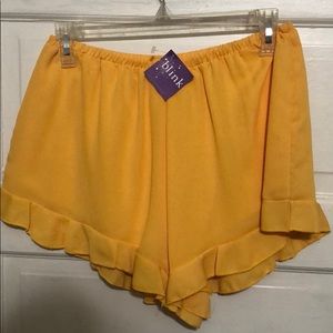 Yellow elastic waist ruffle shorts